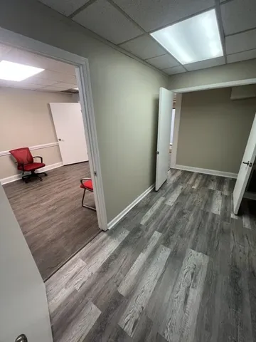 a view of a room & wooden floor