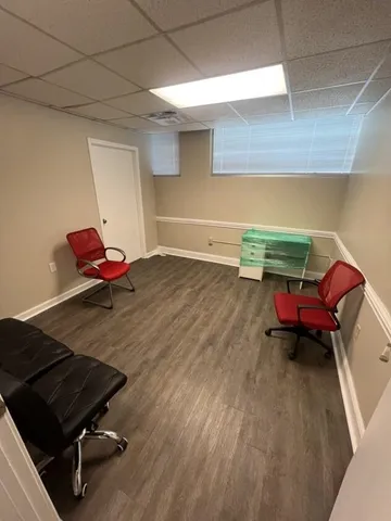 a reading room with furniture and wooden floor