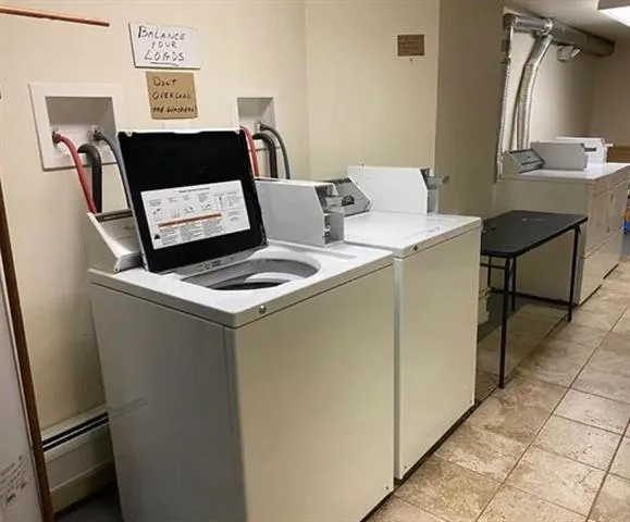 a white refrigerator freezer sitting inside of a kitchen