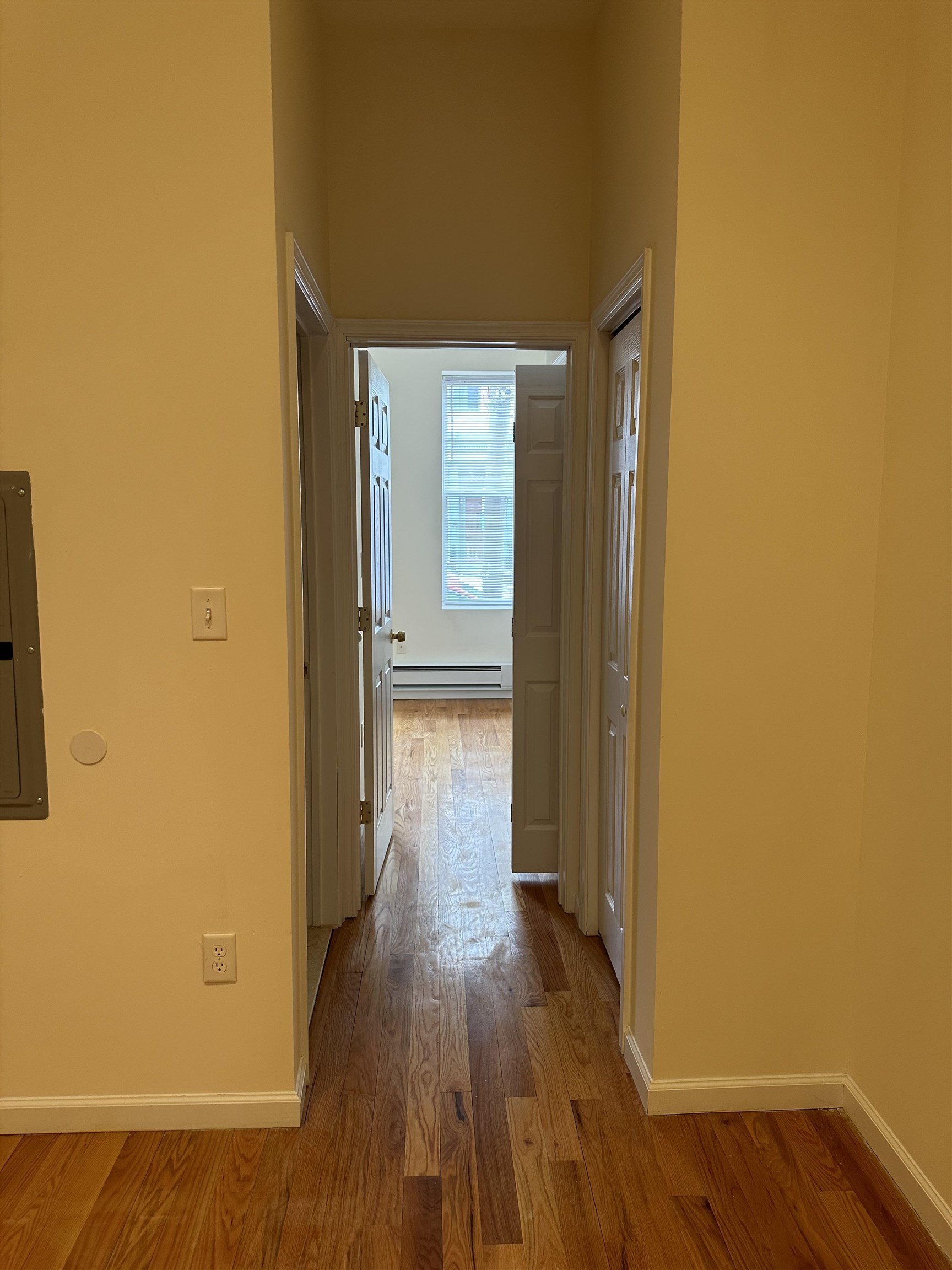 942 Willow Avenue, Unit 1L Hoboken, NJ 07030 - Photo 7 of 12 a view of a hallway with wooden floor