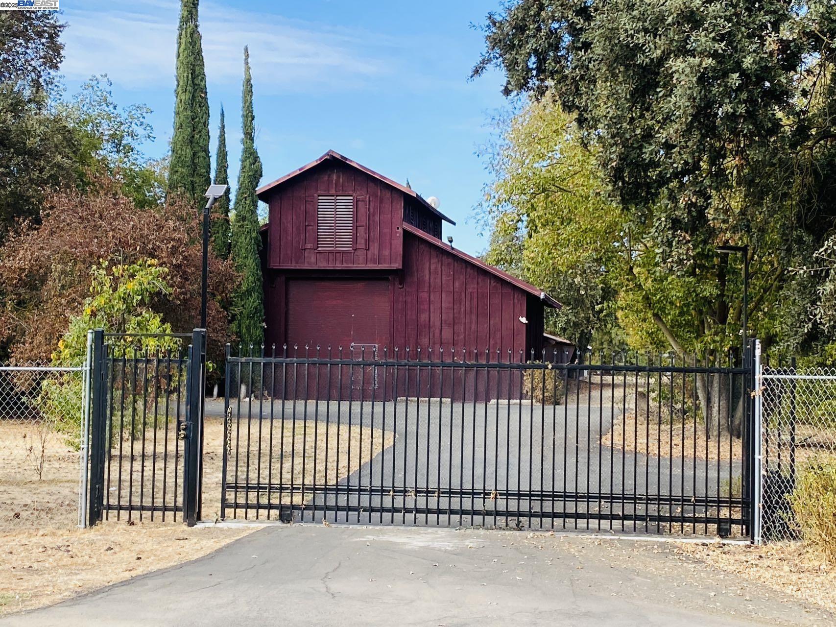 7705 Orford Road Stockton, CA 95215 - Photo 1 of 1 a view of a small house with a small yard and wooden fence
