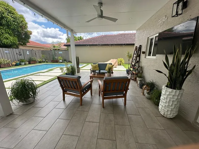 a outdoor living space with furniture and a fireplace