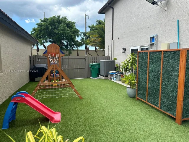 a front view of a house with backyard