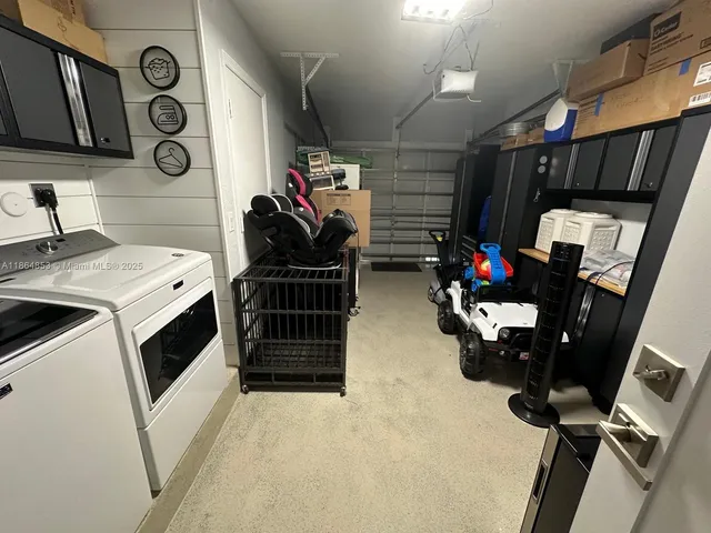 a storage room with washer and dryer