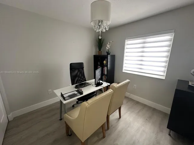 a workspace with furniture and window