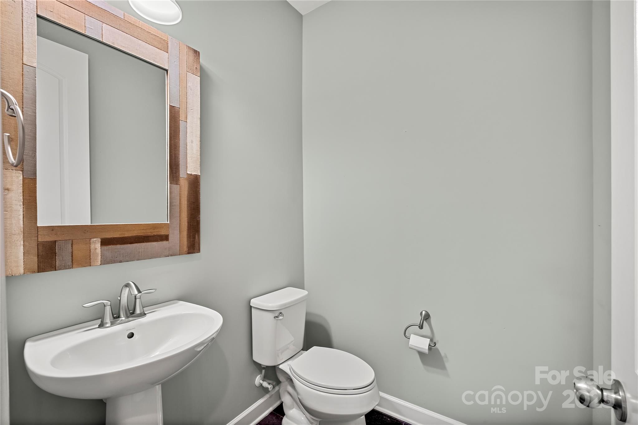 2830 Berkhamstead Circle Concord, NC 28027 - Photo 12 of 27 a bathroom with a sink a toilet and mirror