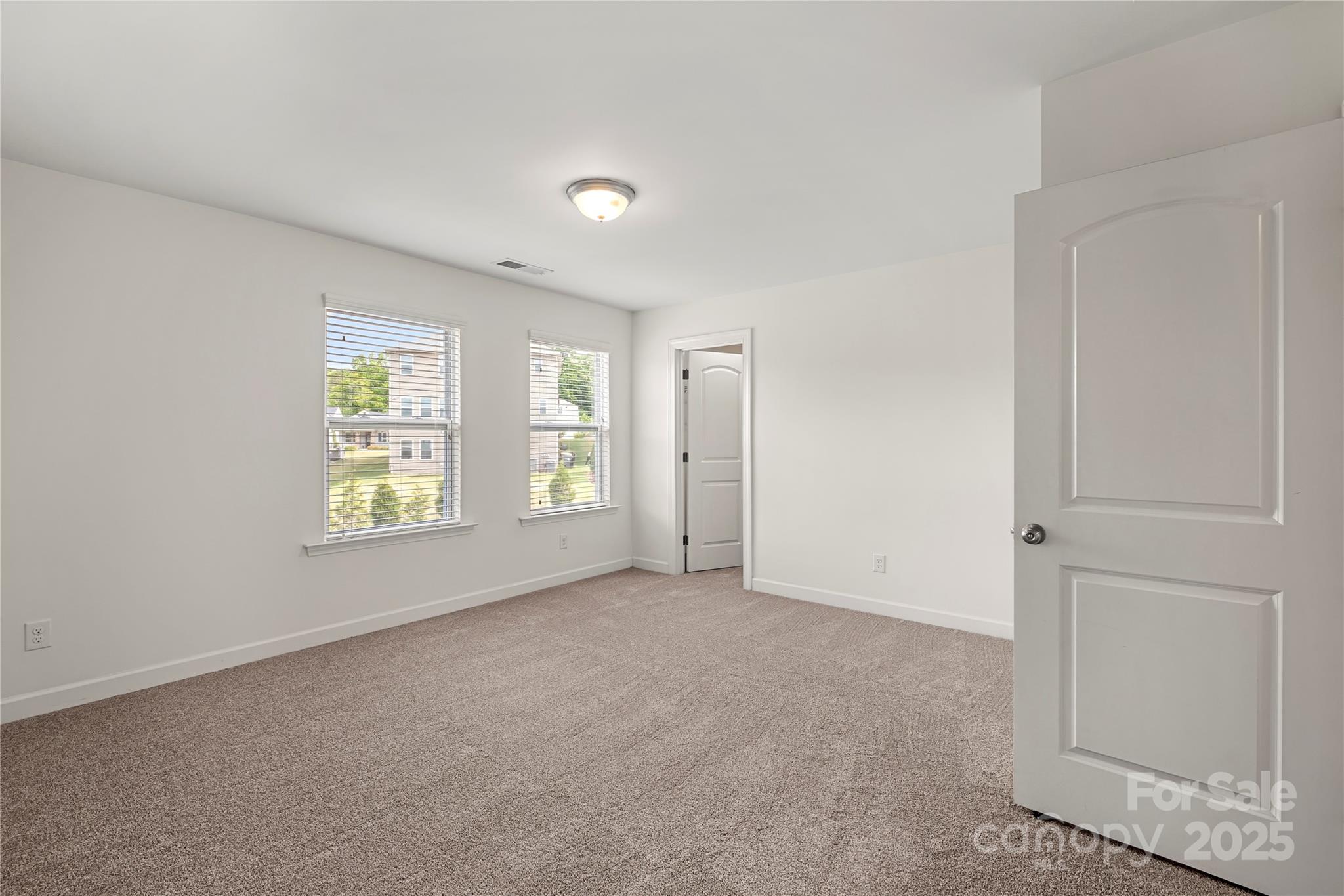 2830 Berkhamstead Circle Concord, NC 28027 - Photo 20 of 27 an empty room with windows