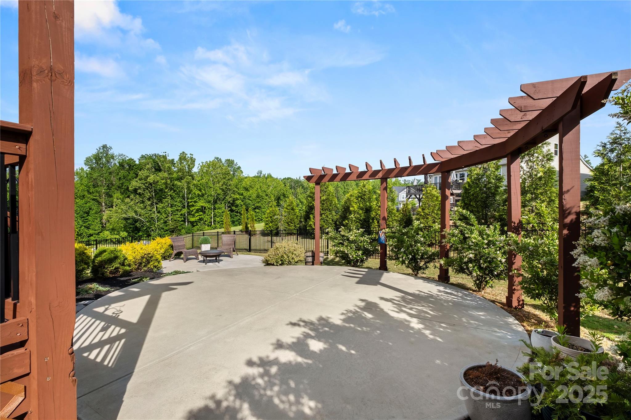 2830 Berkhamstead Circle Concord, NC 28027 - Photo 25 of 27 a view of a backyard with sitting area