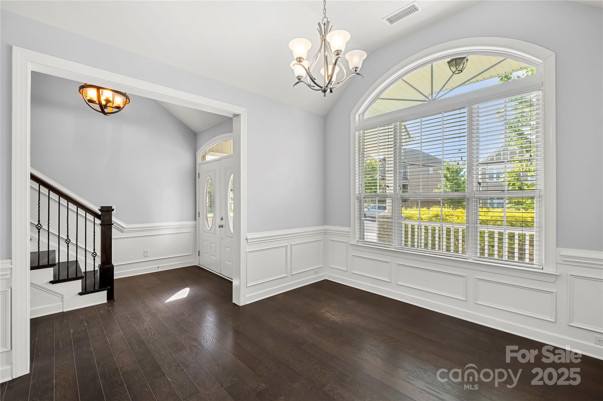 2830 Berkhamstead Circle Concord, NC 28027 - Photo 4 of 27 a view of an entryway with wooden floor and windows