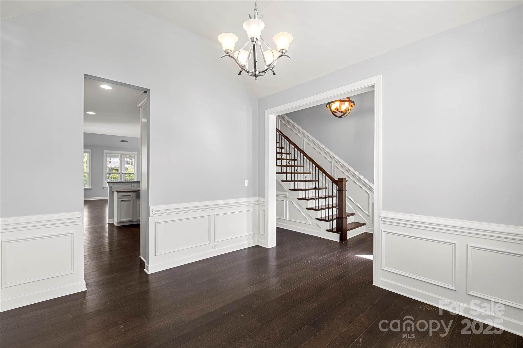 2830 Berkhamstead Circle Concord, NC 28027 - Photo 5 of 27 a view of a livingroom with wooden floor and staircase