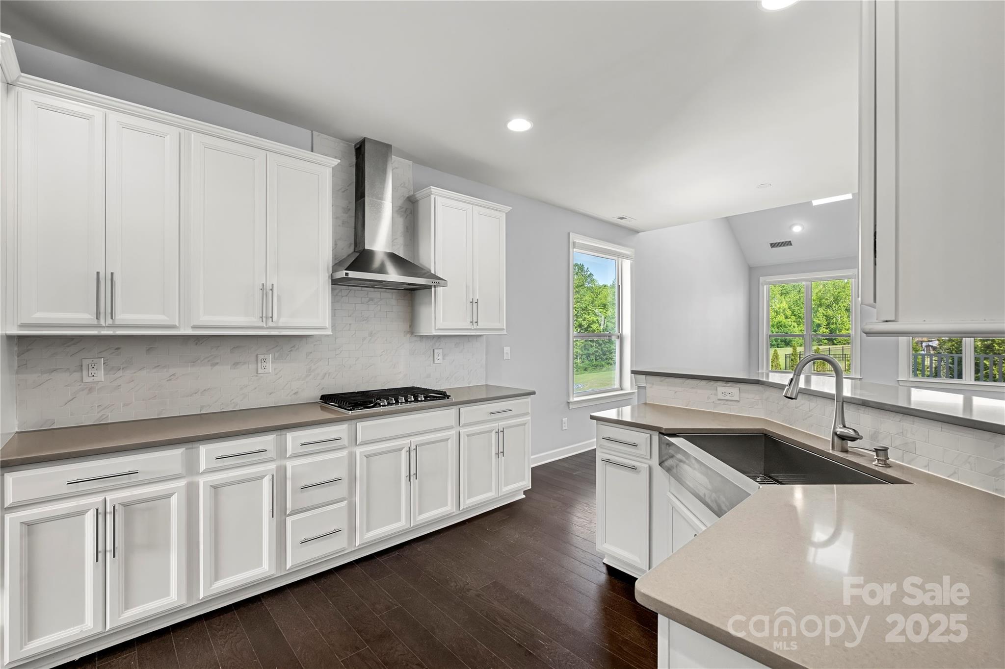 2830 Berkhamstead Circle Concord, NC 28027 - Photo 8 of 27 a kitchen with stainless steel appliances granite countertop a sink stove and cabinets