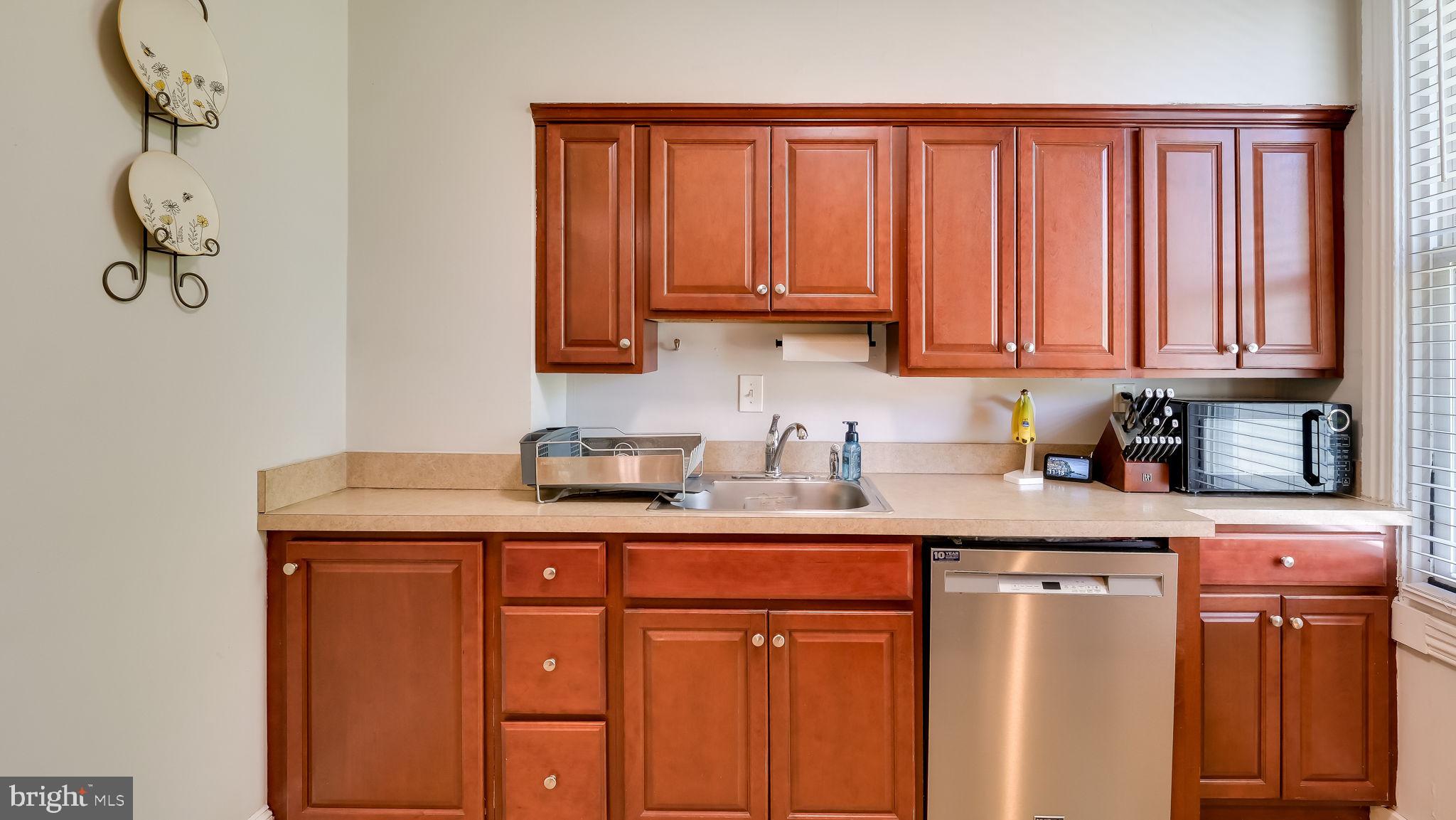 264 North Aberdeen Avenue Wayne, PA 19087 - Photo 12 of 18 a kitchen with stainless steel appliances granite countertop a sink and cabinets