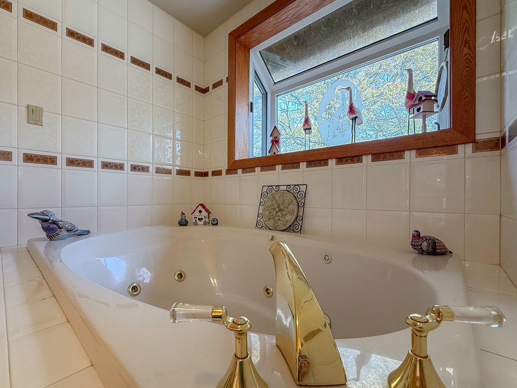 13581 Solitude Trail Machipongo, VA 23405 - Photo 19 of 51 a bathroom with a bathtub