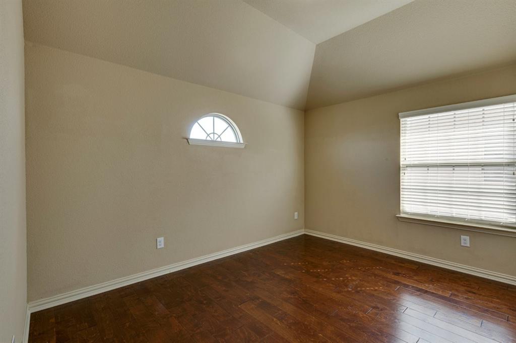 1522 Blue Jay Road Garland, TX 75043 - Photo 30 of 32 Room with wood-finish flooring, neutral wall tones, and white baseboards