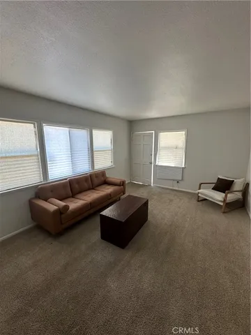 a living room with a couch and a window