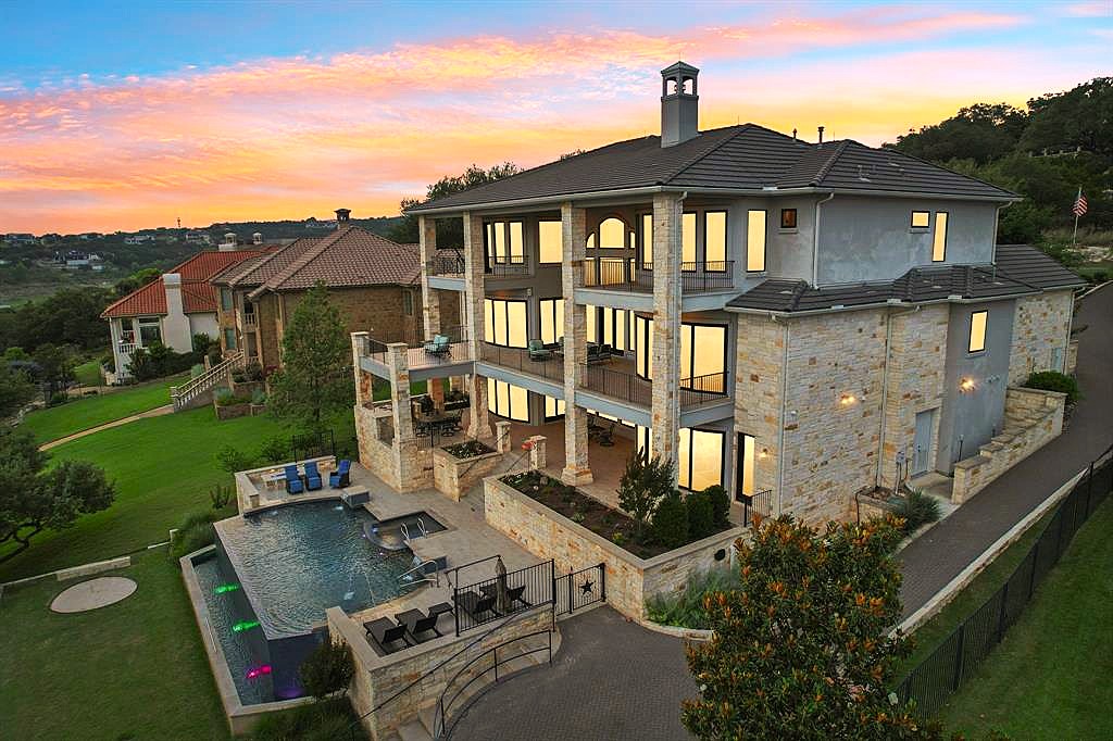 1353 Osprey Ridge Loop Lago Vista, TX 78645 - Photo 1 of 40 So many outdoor options for enjoying the view... private & main balconies, covered patio, outdoor kitchen, open terrace, poolside deck, pool, spa, horseshoe court.