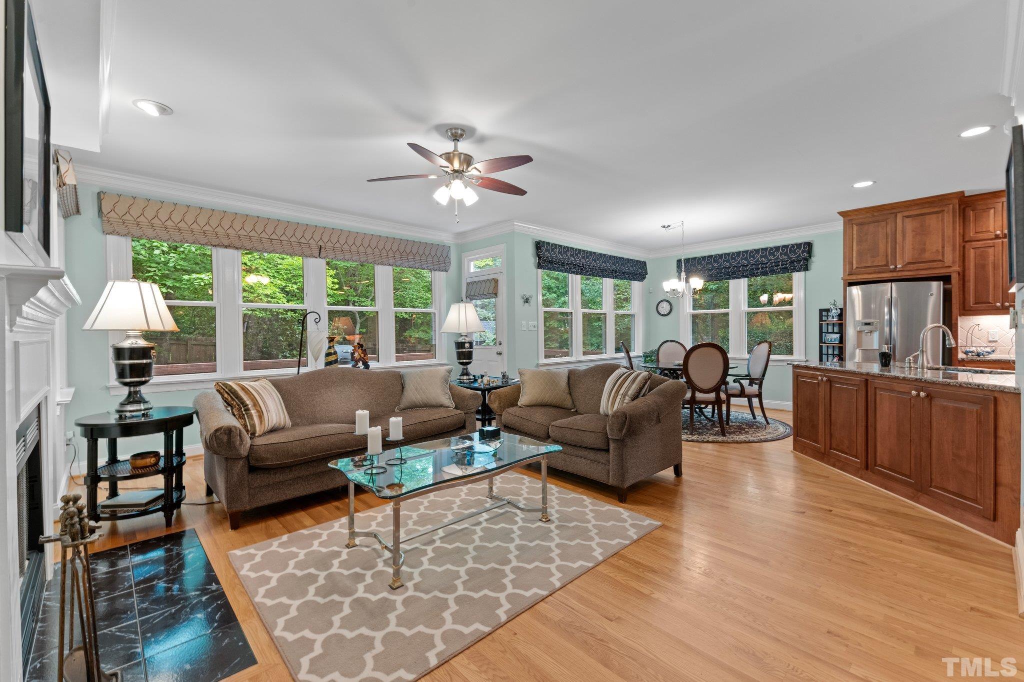 3812 Evander Way Raleigh, NC 27613 - Photo 12 of 52 a living room with furniture fireplace and a large window
