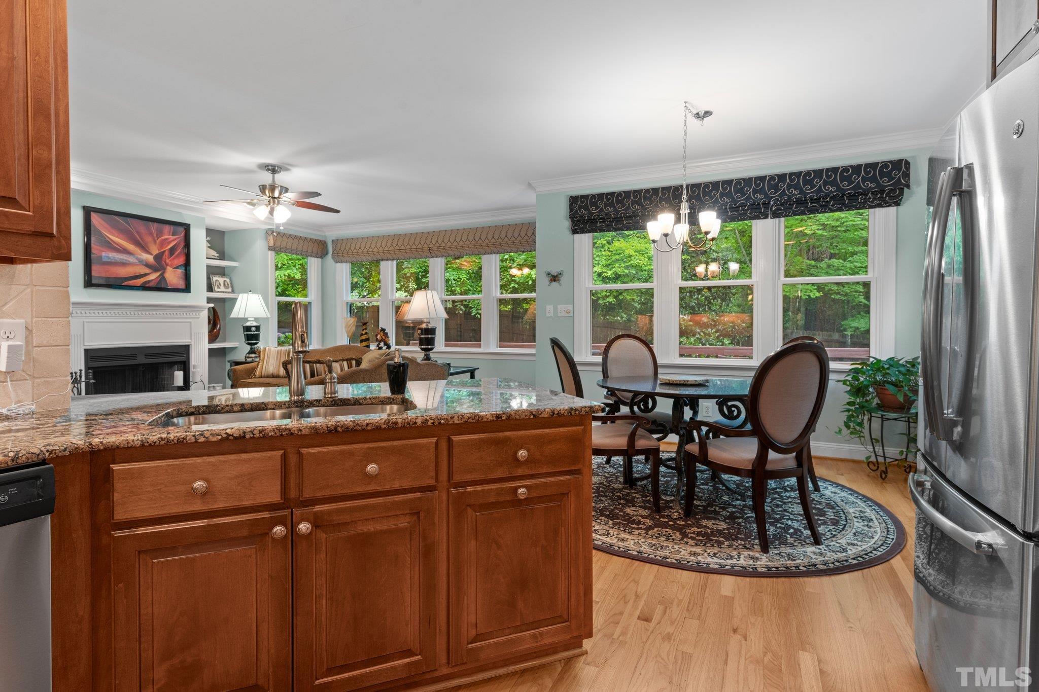 3812 Evander Way Raleigh, NC 27613 - Photo 19 of 52 a dining room with furniture a chandelier and window