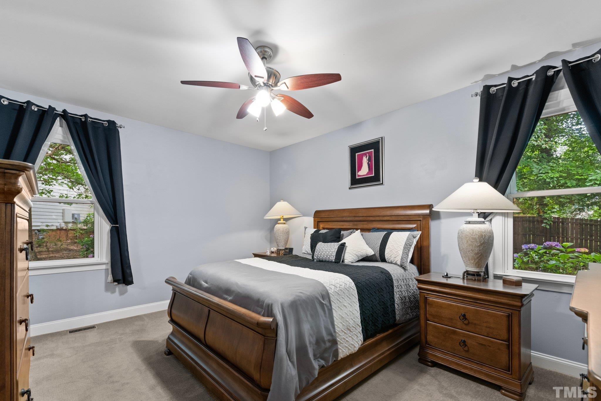 3812 Evander Way Raleigh, NC 27613 - Photo 22 of 52 a bed room with a bed and a window
