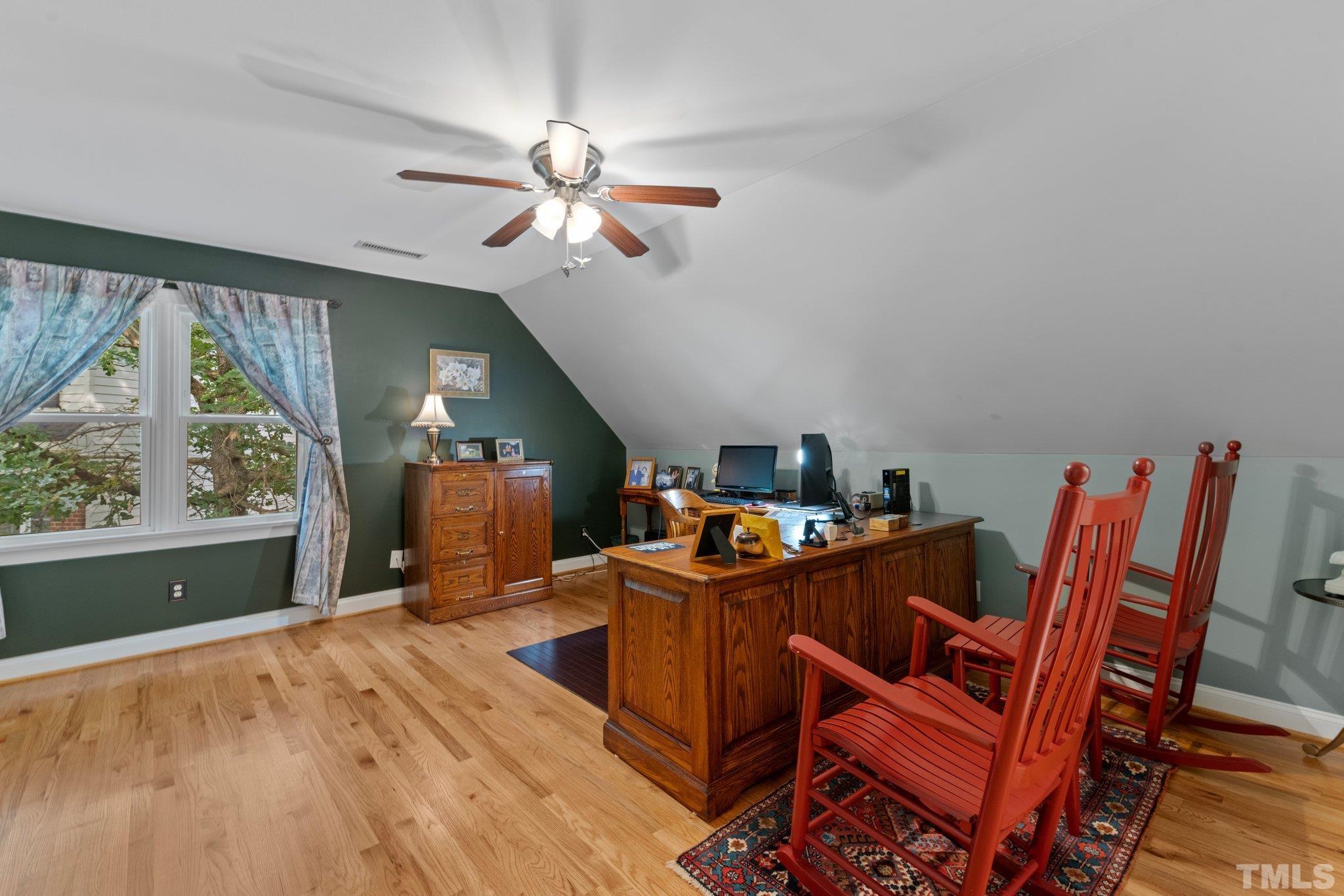 3812 Evander Way Raleigh, NC 27613 - Photo 35 of 52 a view of a dining room with furniture window and wooden floor