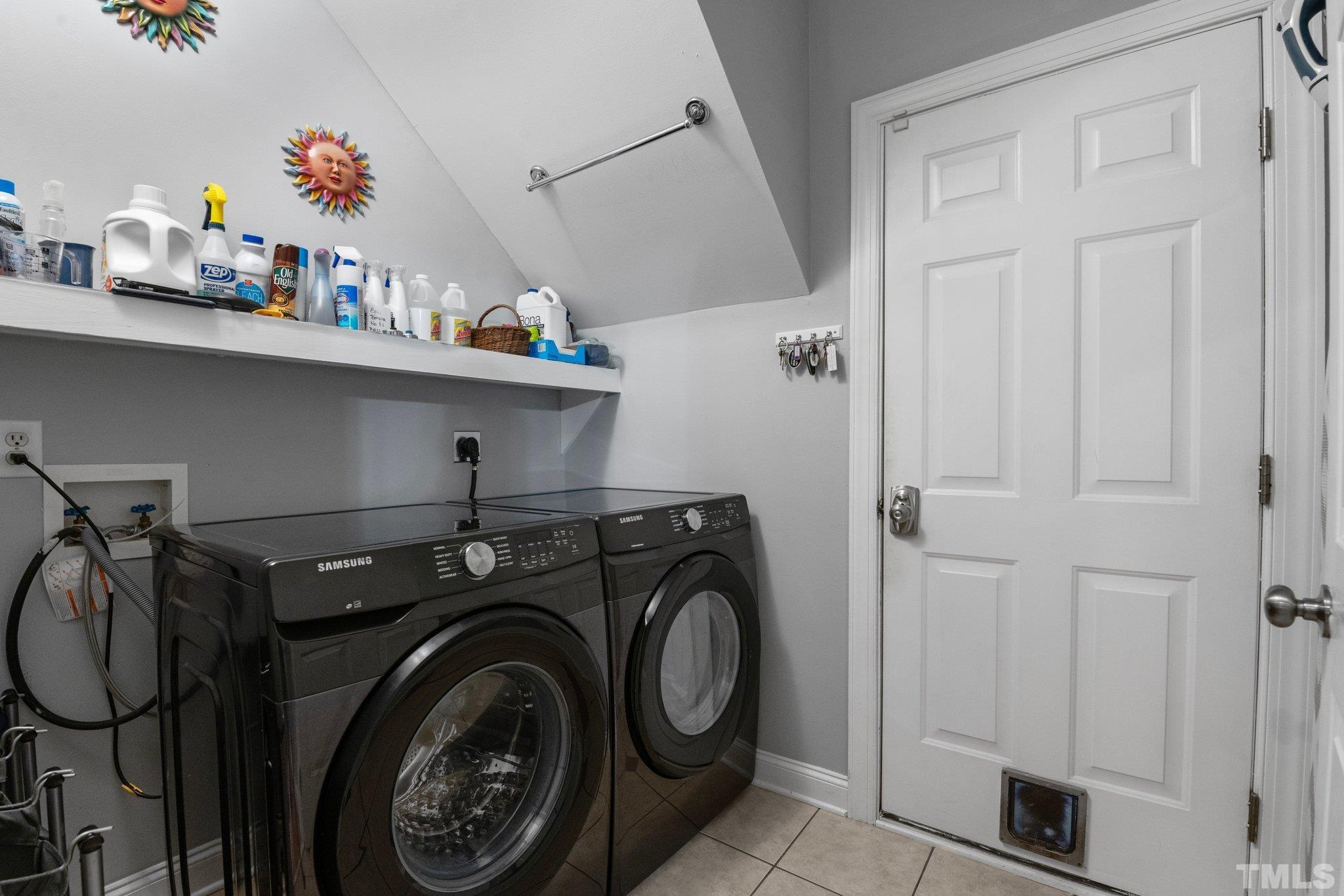 3812 Evander Way Raleigh, NC 27613 - Photo 37 of 52 a utility room with dryer and washer