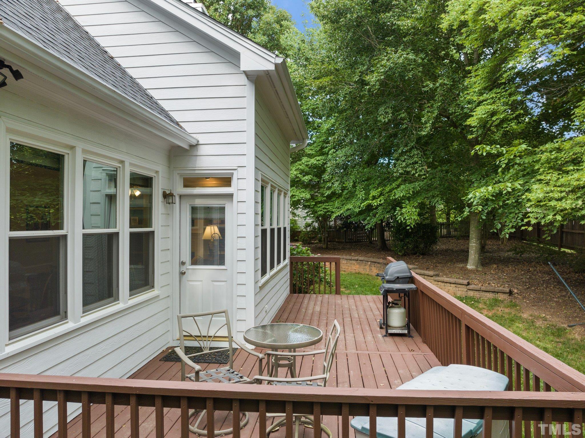 3812 Evander Way Raleigh, NC 27613 - Photo 42 of 52 a balcony with table and chairs