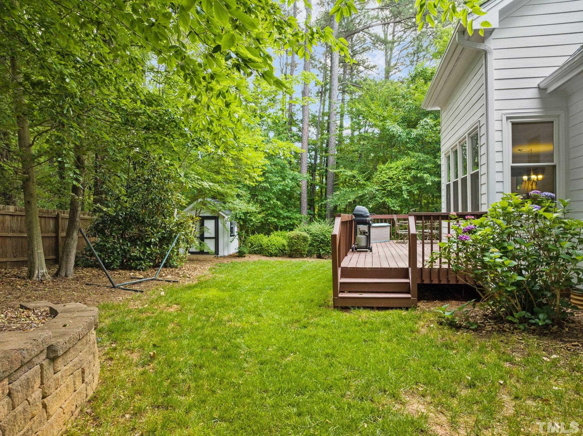 3812 Evander Way Raleigh, NC 27613 - Photo 46 of 52 a front view of a house with a garden