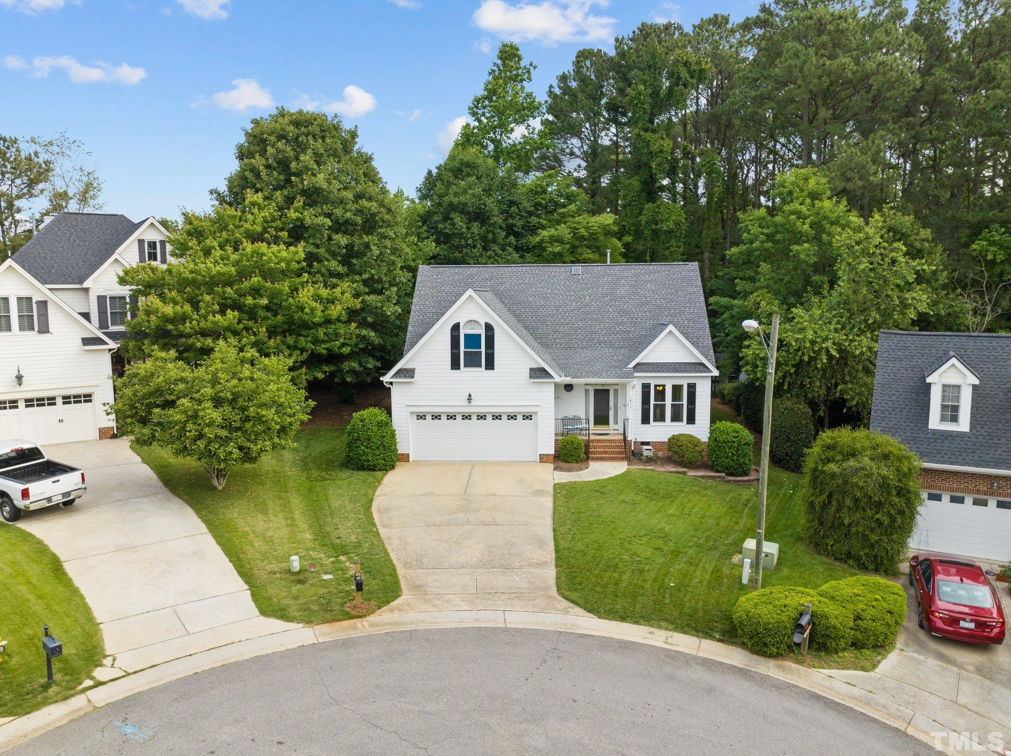 3812 Evander Way Raleigh, NC 27613 - Photo 48 of 52 front view of a house with a street