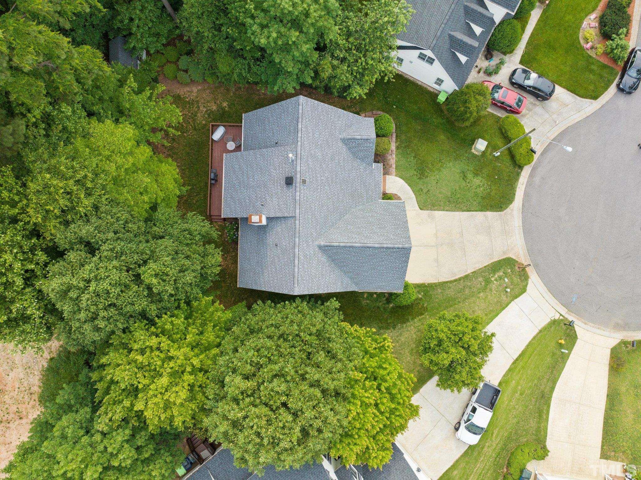 3812 Evander Way Raleigh, NC 27613 - Photo 49 of 52 an aerial view of a house with a yard and trees