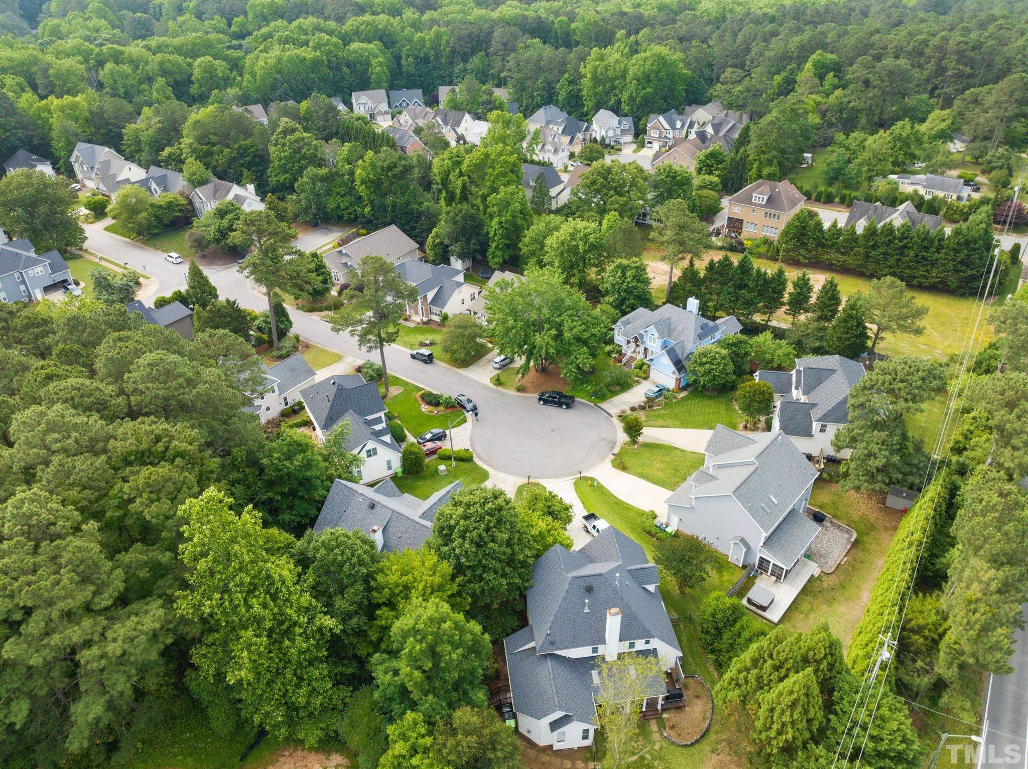 3812 Evander Way Raleigh, NC 27613 - Photo 51 of 52 an aerial view of a house with a yard and lake view