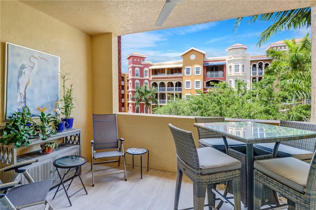 401 Bayfront Place, Unit 3306 Naples, FL 34102 - Photo 16 of 26 a view of a chairs and table in a balcony