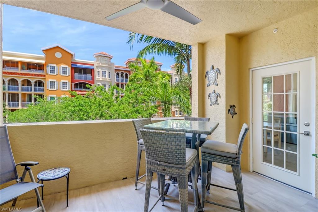 401 Bayfront Place, Unit 3306 Naples, FL 34102 - Photo 17 of 26 a view of a chairs and table in a balcony