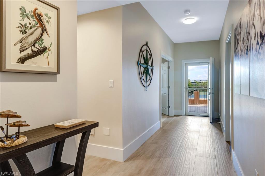 401 Bayfront Place, Unit 3306 Naples, FL 34102 - Photo 2 of 26 a view of a hallway and wooden floor