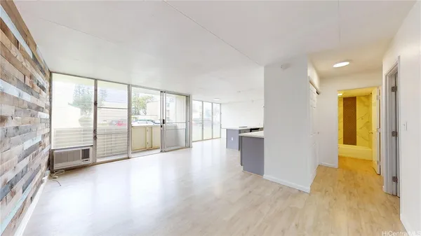 a view of an entryway with wooden floor
