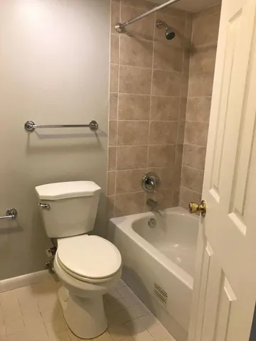 a bathroom with a toilet and a sink