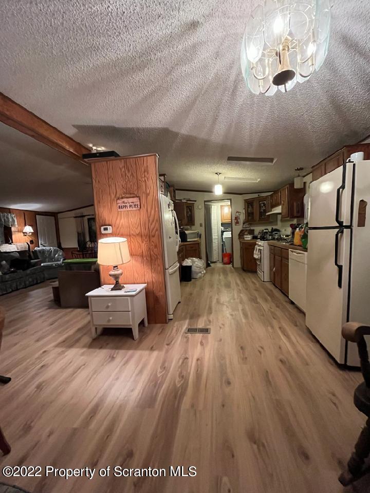 299 Cascade Valley Road Windsor, NY 13865 - Photo 3 of 9 a living room with furniture and a wooden floor