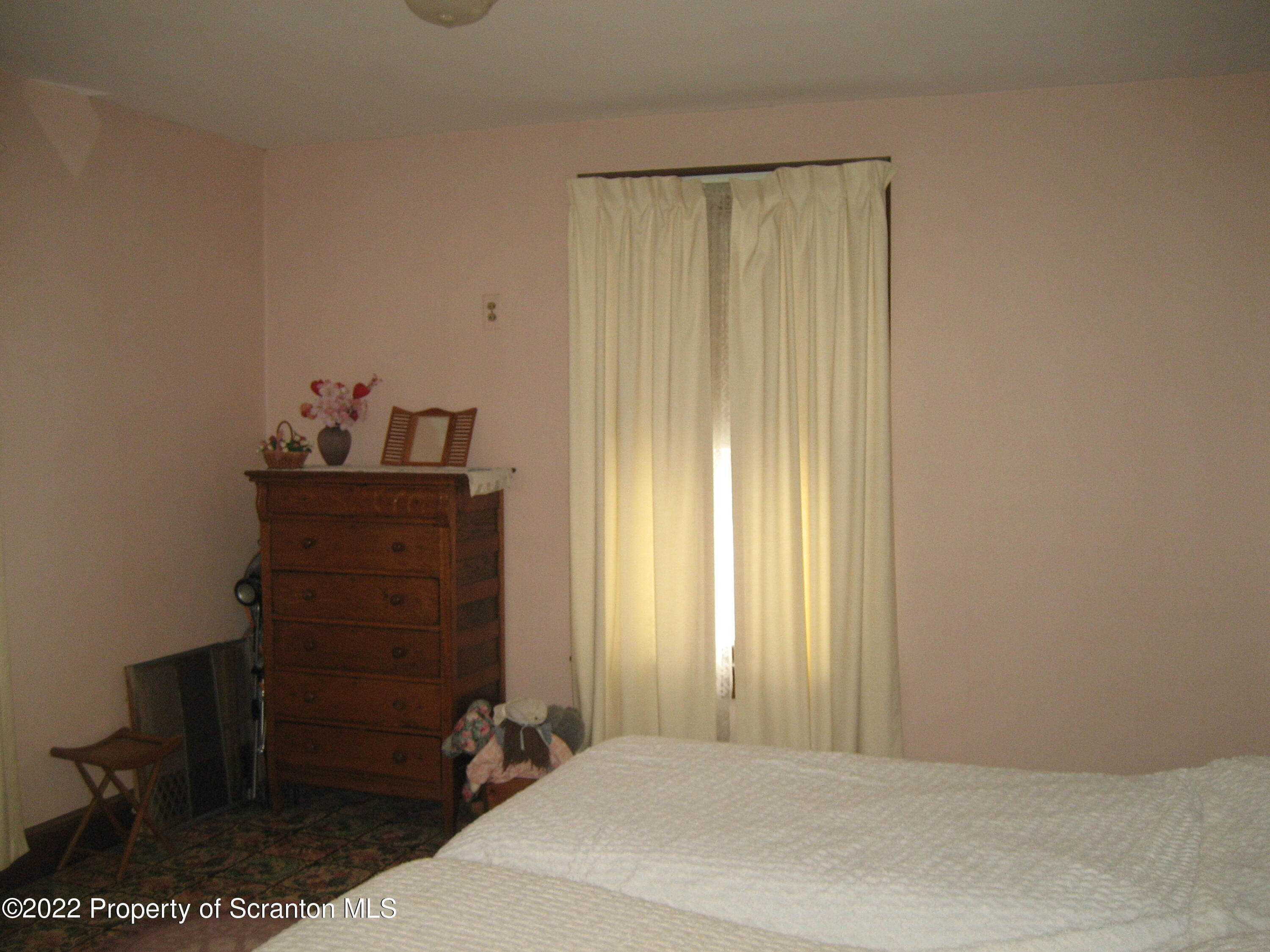 299 Cascade Valley Road Windsor, NY 13865 - Photo 8 of 9 a bedroom with a bed and a window