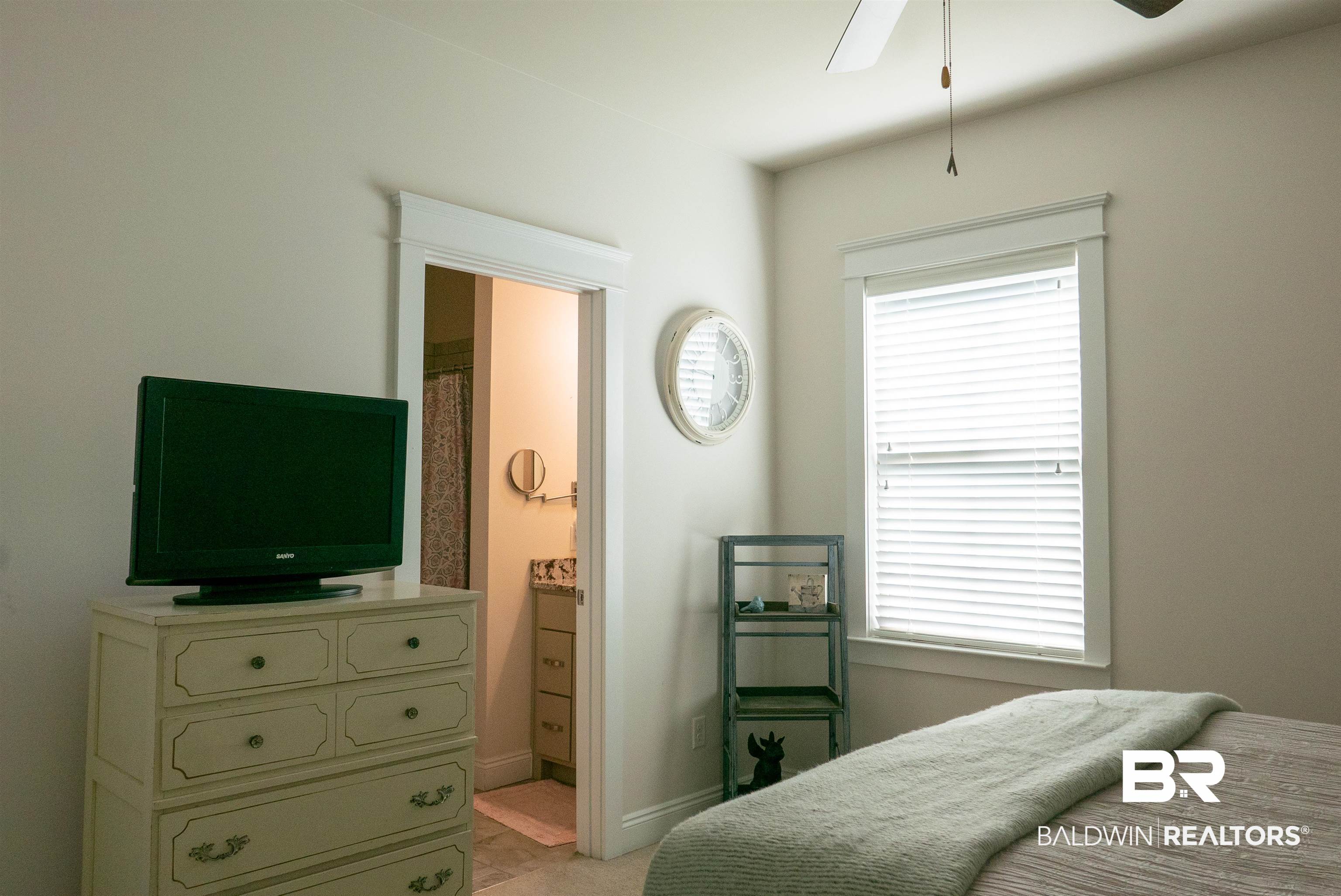 6684 Garrison Drive Daphne, AL 36527 - Photo 20 of 35 Tiled bedroom with ceiling fan and ensuite bath