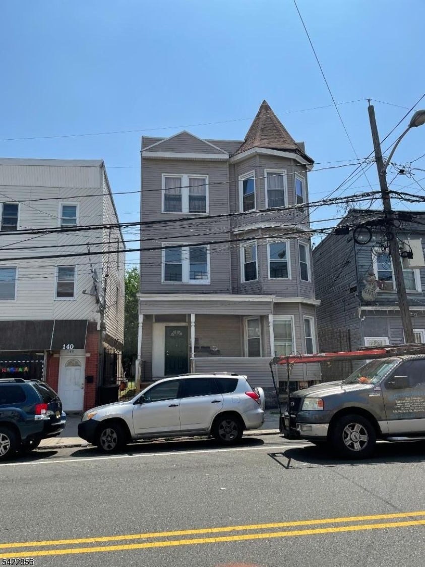 a view of a car parked in front of a building