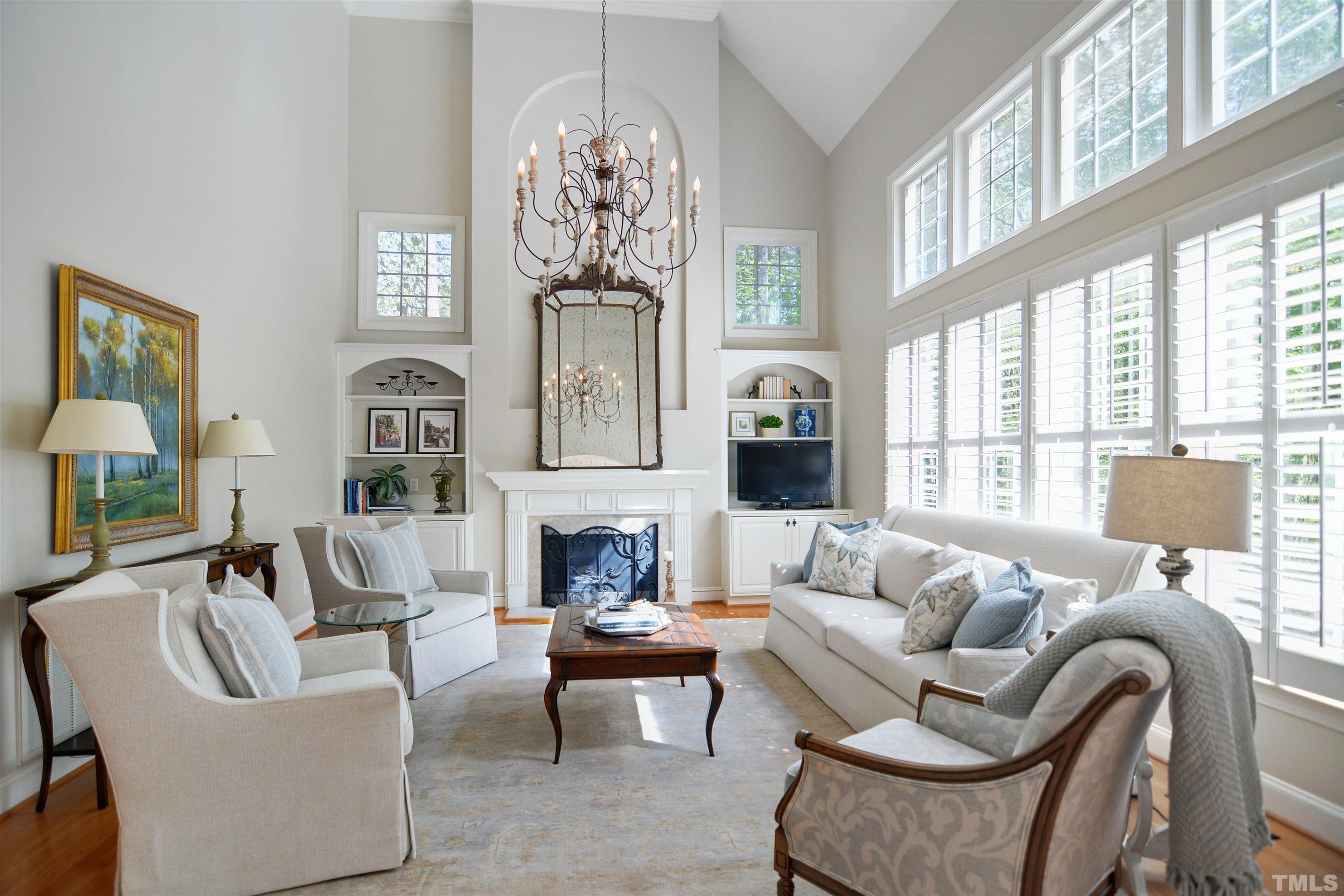 5205 Azure Lane Raleigh, NC 27613 - Photo 8 of 38 a living room with furniture and a chandelier