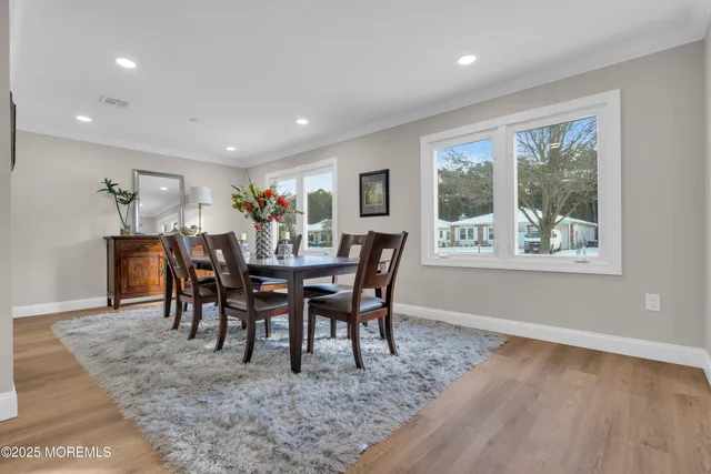 a view of a dining room that has a table and chairs in it