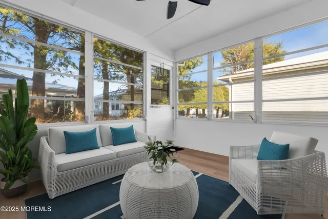 a bedroom with a flat screen television bed and a flat screen tv