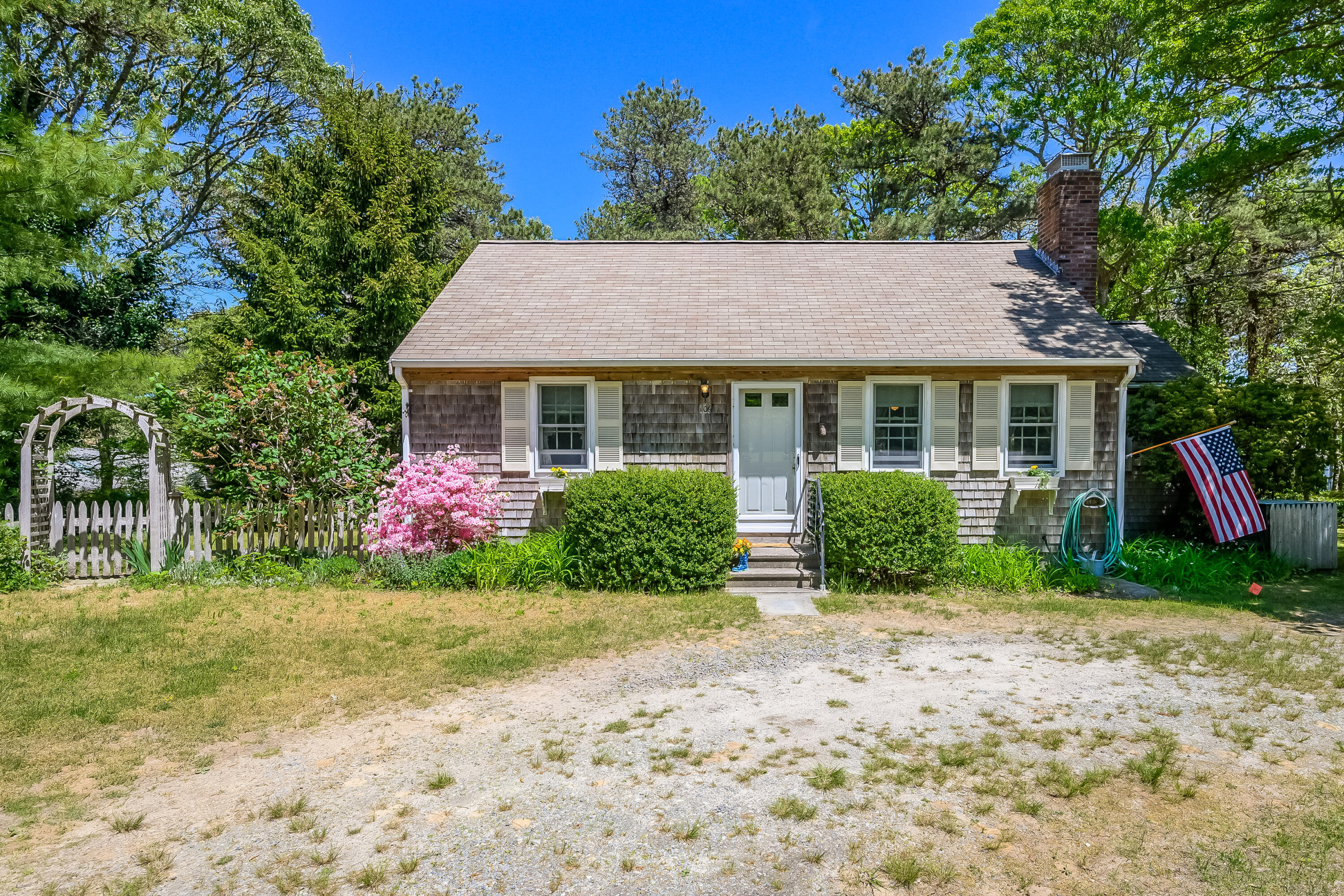 a front view of a house with garden