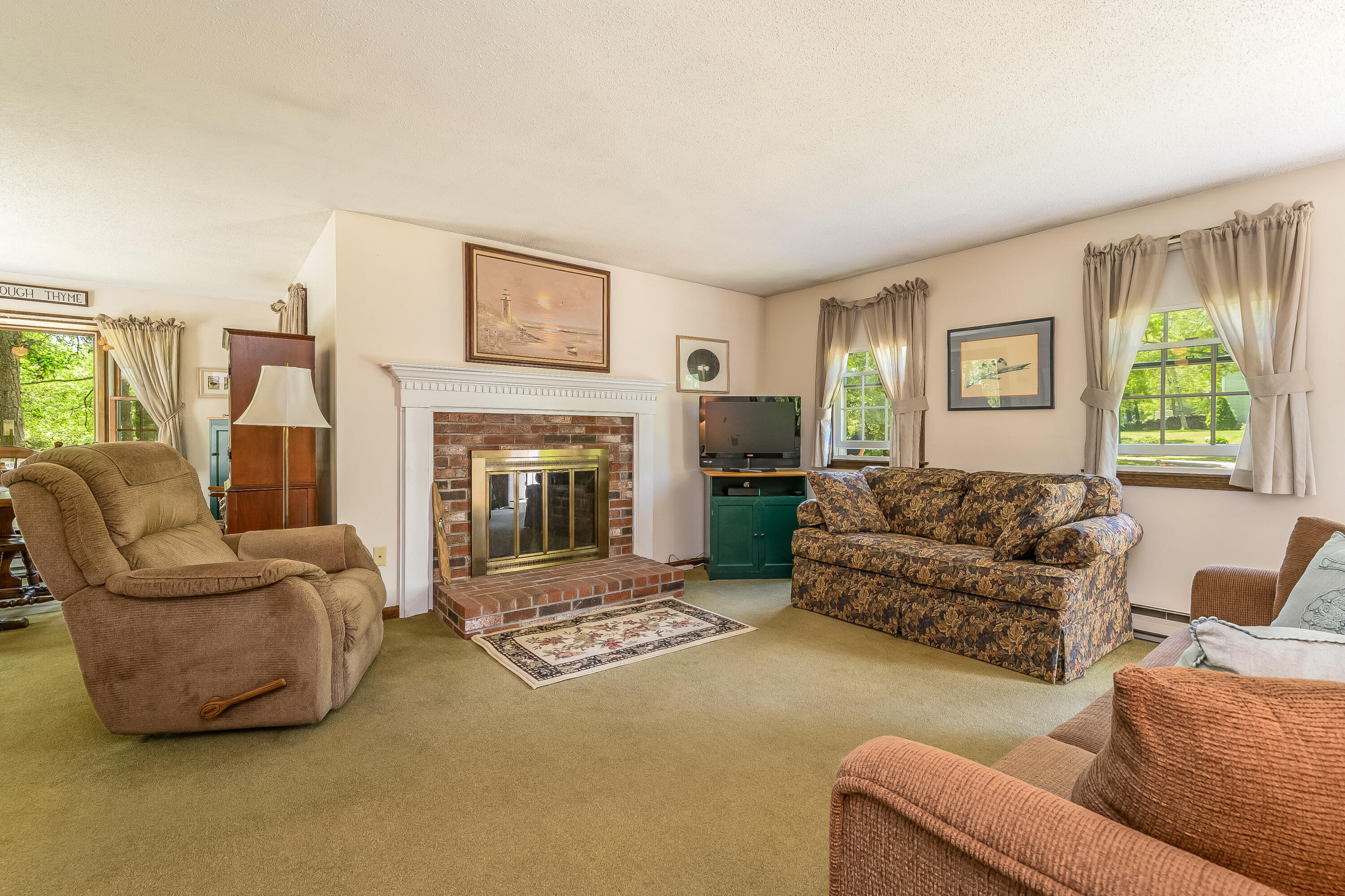 106 Tower Hill Circle Brewster, MA 02631 - Photo 5 of 19 a living room with furniture and a fireplace