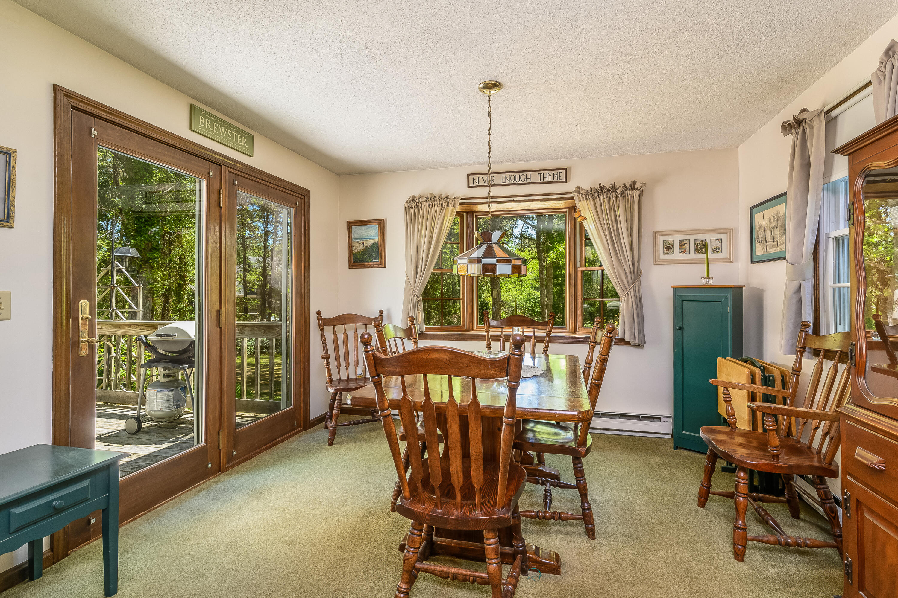 106 Tower Hill Circle Brewster, MA 02631 - Photo 9 of 19 a view of a dining room with furniture window and outside view