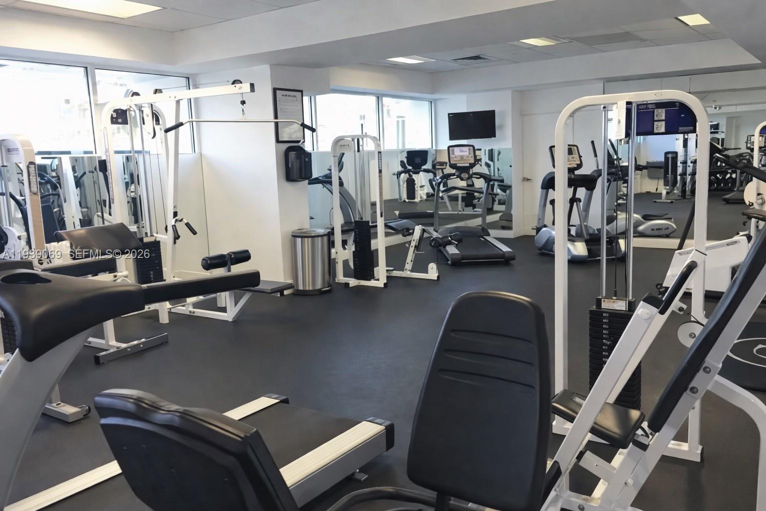 5900 Collins Avenue, Unit 1405 Miami Beach, FL 33140 - Photo 34 of 38 a view of a room with gym equipment