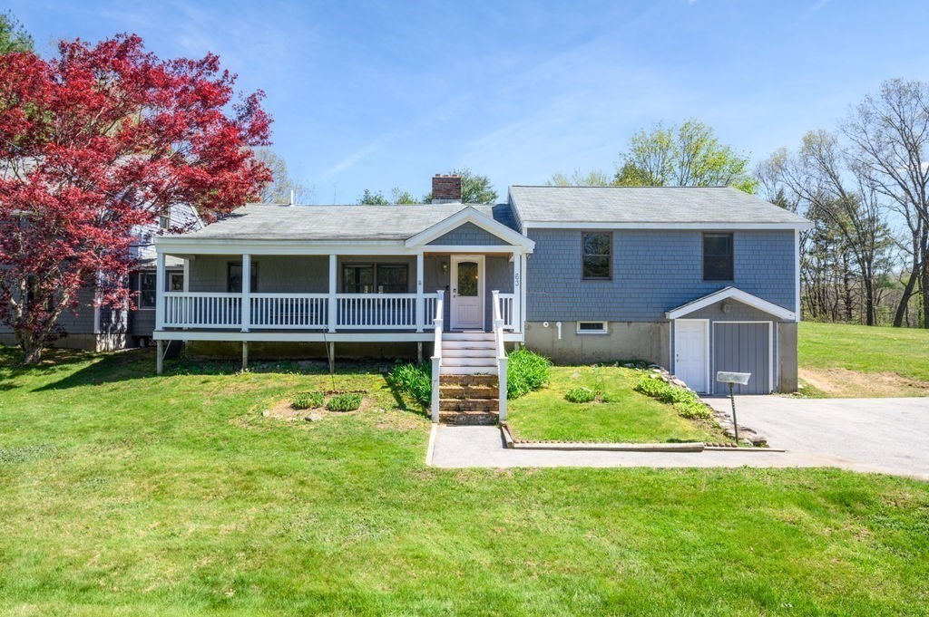 63 Middle Road Amesbury, MA 01913 - Photo 1 of 37 a view of a house with a yard and potted plants