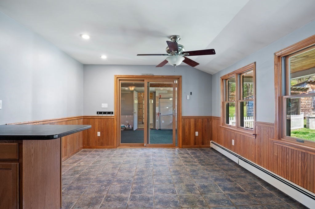 63 Middle Road Amesbury, MA 01913 - Photo 14 of 37 a living room with granite countertop furniture a ceiling fan and a window