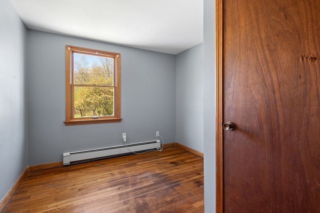 63 Middle Road Amesbury, MA 01913 - Photo 15 of 37 a view of an empty room with window and closet area