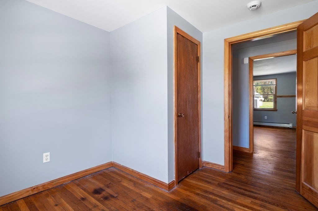 63 Middle Road Amesbury, MA 01913 - Photo 16 of 37 an empty room with wooden floor and closet